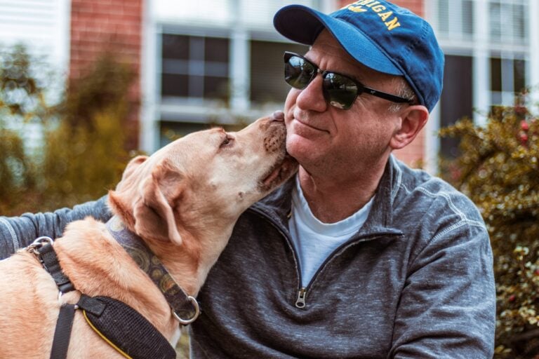 benefits of pets for seniors staying active with dog outdoors