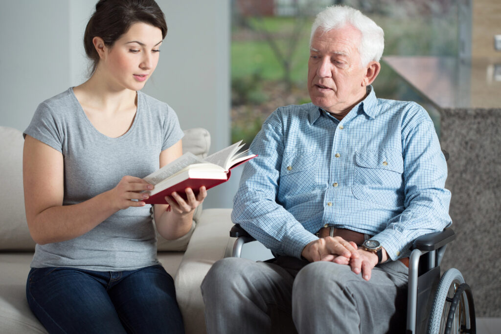 Family caregiver reviewing hospital discharge instructions with a senior at home after a hospital stay in Texas.